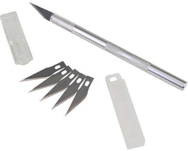 X-acto knife with handle. 