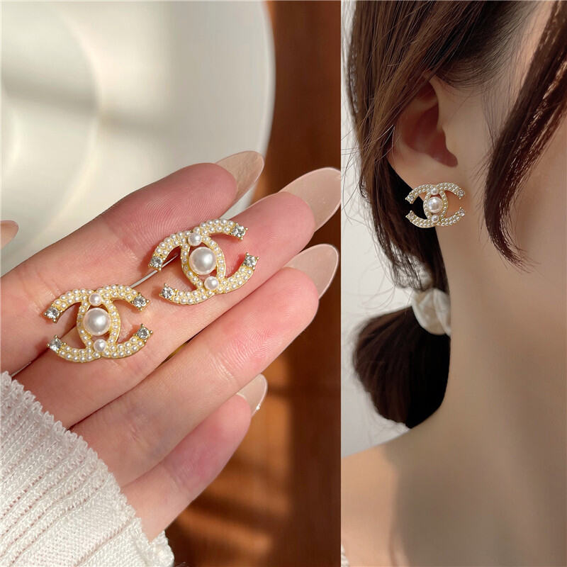 The Two Chanel Earrings Look So Chic I Love The Double Piercing Chanel Stud  Earrings, Chanel Earrings, Chanel Sign 